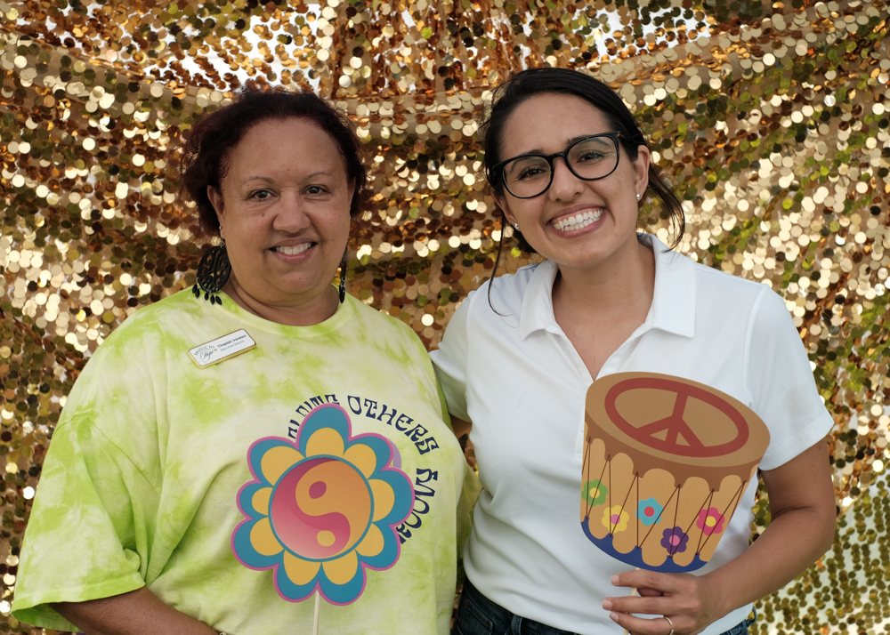 Vanessa Tinsley and Luisa Santos taking a quick photo while working at a recent Stamp Out Hunger event in collaboration with the U.S. Postal Service.